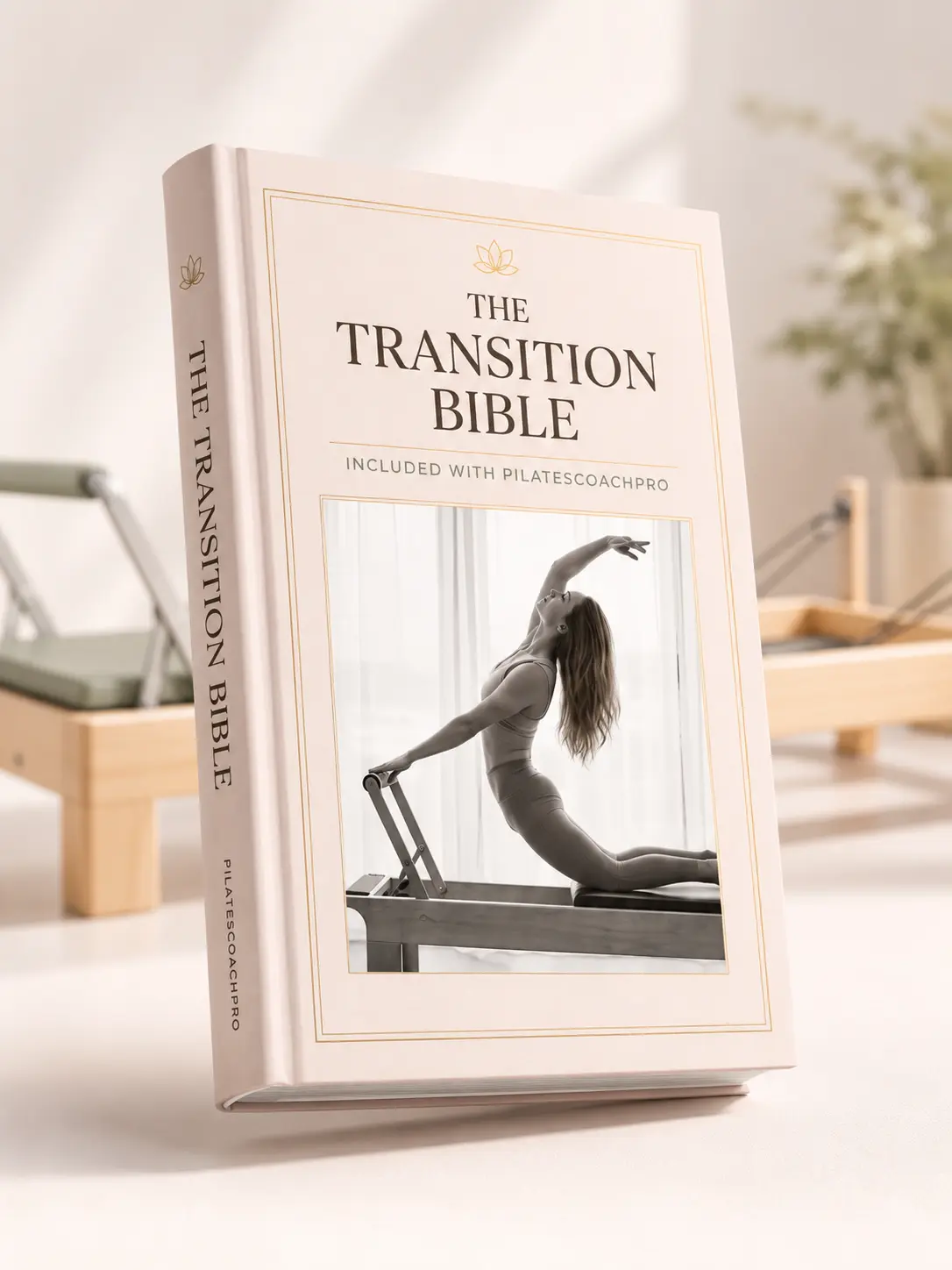 The Transition Bible shown as a printed hardcover standing in a reformer studio.